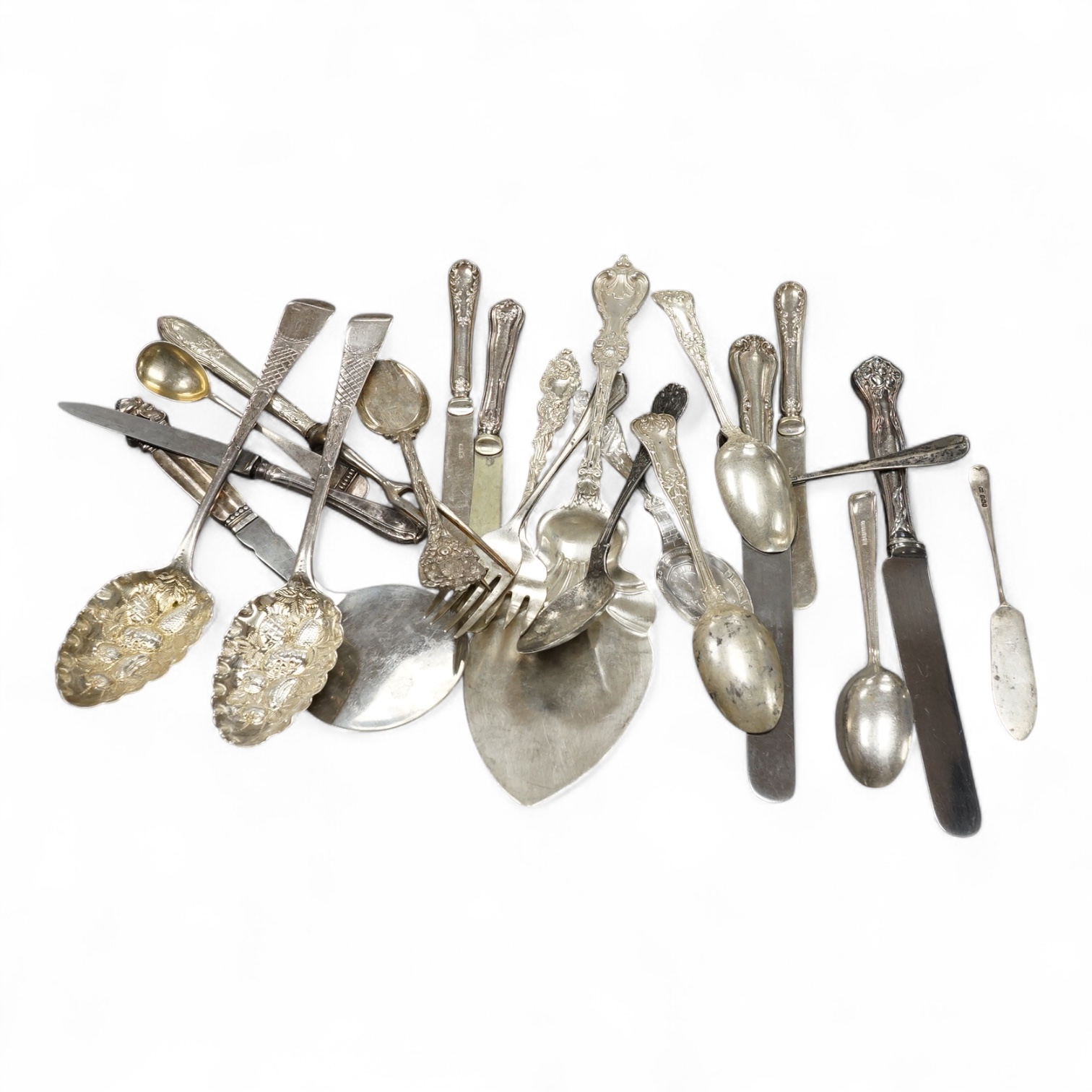 A group of assorted flatware including a matched pair of George III silver berry spoons, London, 1808, a Georg Jensen sterling handled steel server and other silver, white metal and sterling items, including knives. Cond